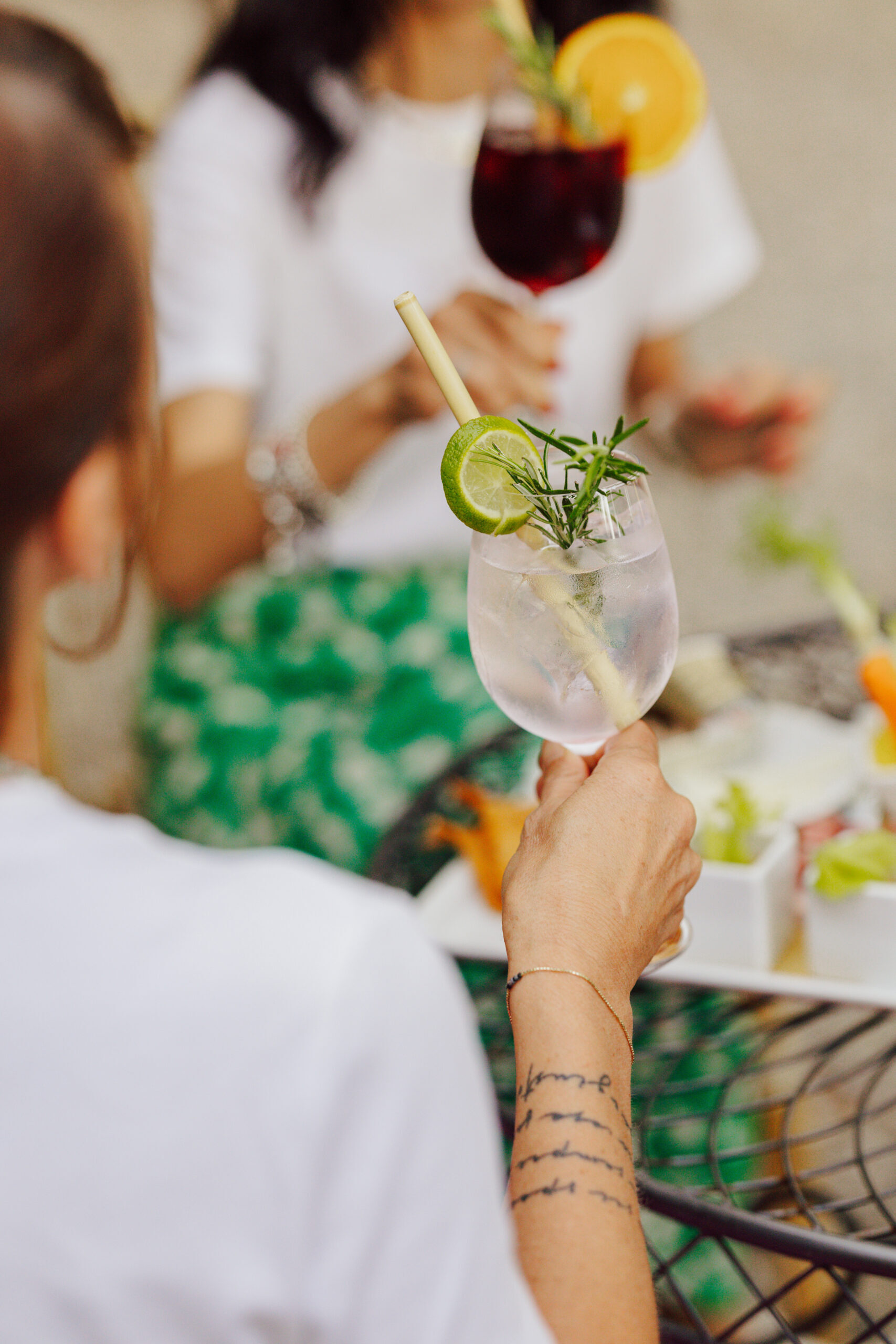 A cocktail with lime and rosemary served during Rosso di Sera at Villa Dianella